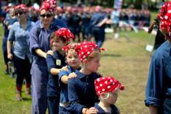 Women and Girls Dressed as Rosie the Riviter
