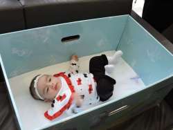 Baby Sleeping in a Box