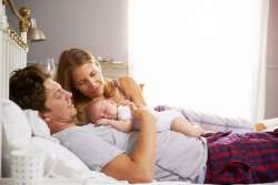 new parents getting baby to sleep