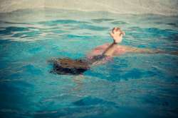 young girl swimming underwater