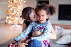 mom talking to crying daughter about emotional literacy