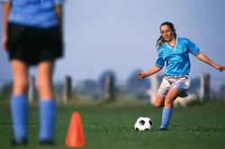 Girl teen playing soccer